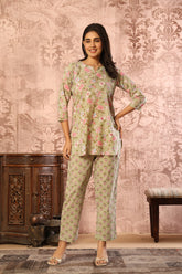 Olive green floral printed cotton co-ord set featuring a kurti and straight pants by Rouhab.