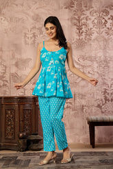 Turquoise blue printed cotton co-ord set featuring a spaghetti kurti and straight pants by Rouhab.