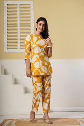 Mustard yellow geometric printed cotton co-ord set with kurti and straight pants by Rouhab, stylish and comfortable for casual wear.