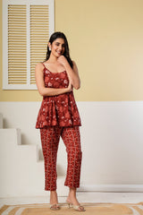 Rust red floral printed cotton co-ord set featuring a spaghetti kurti and straight pants from Rouhab.