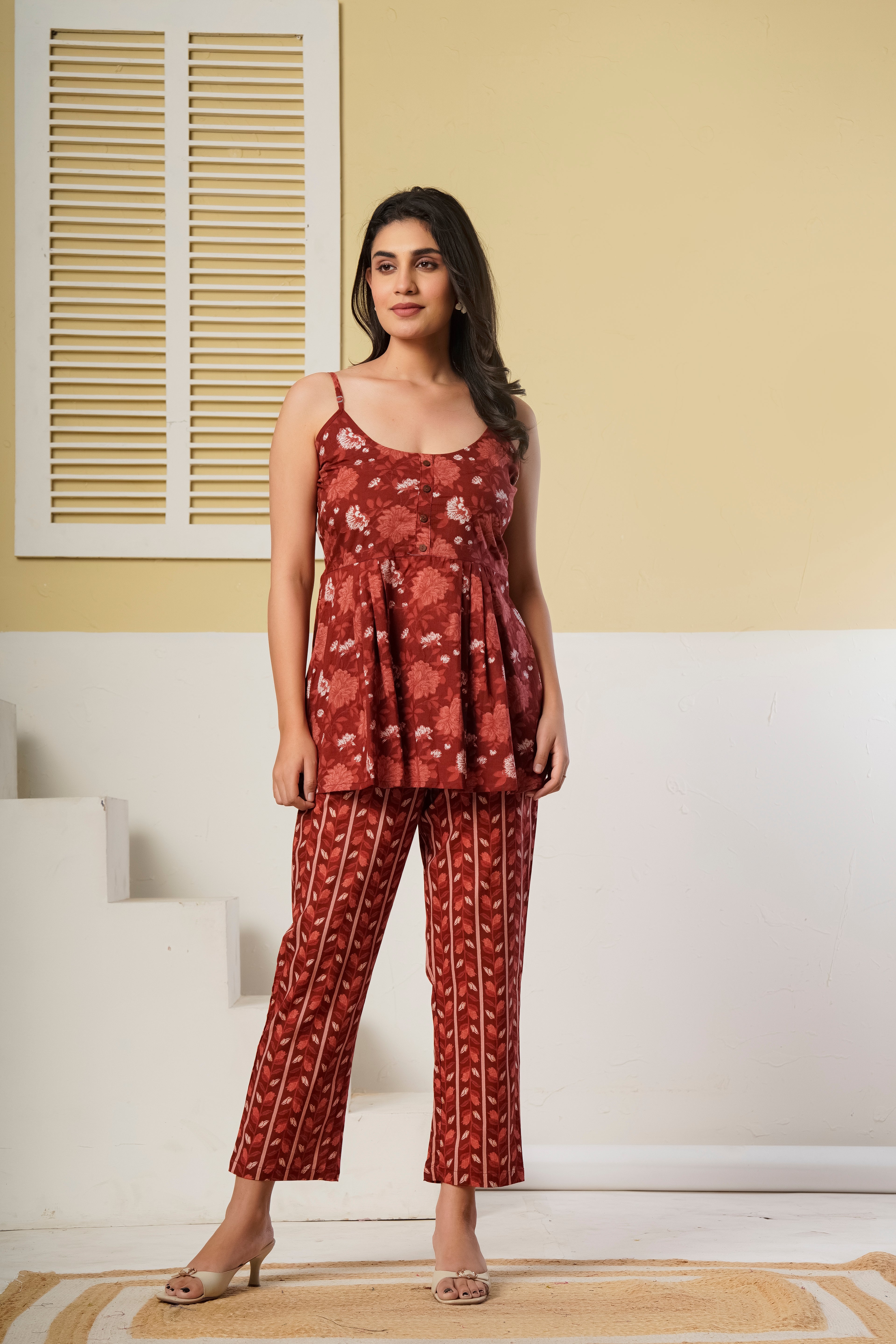Rust red floral printed cotton co-ord set featuring a spaghetti kurti and straight pants by Rouhab.