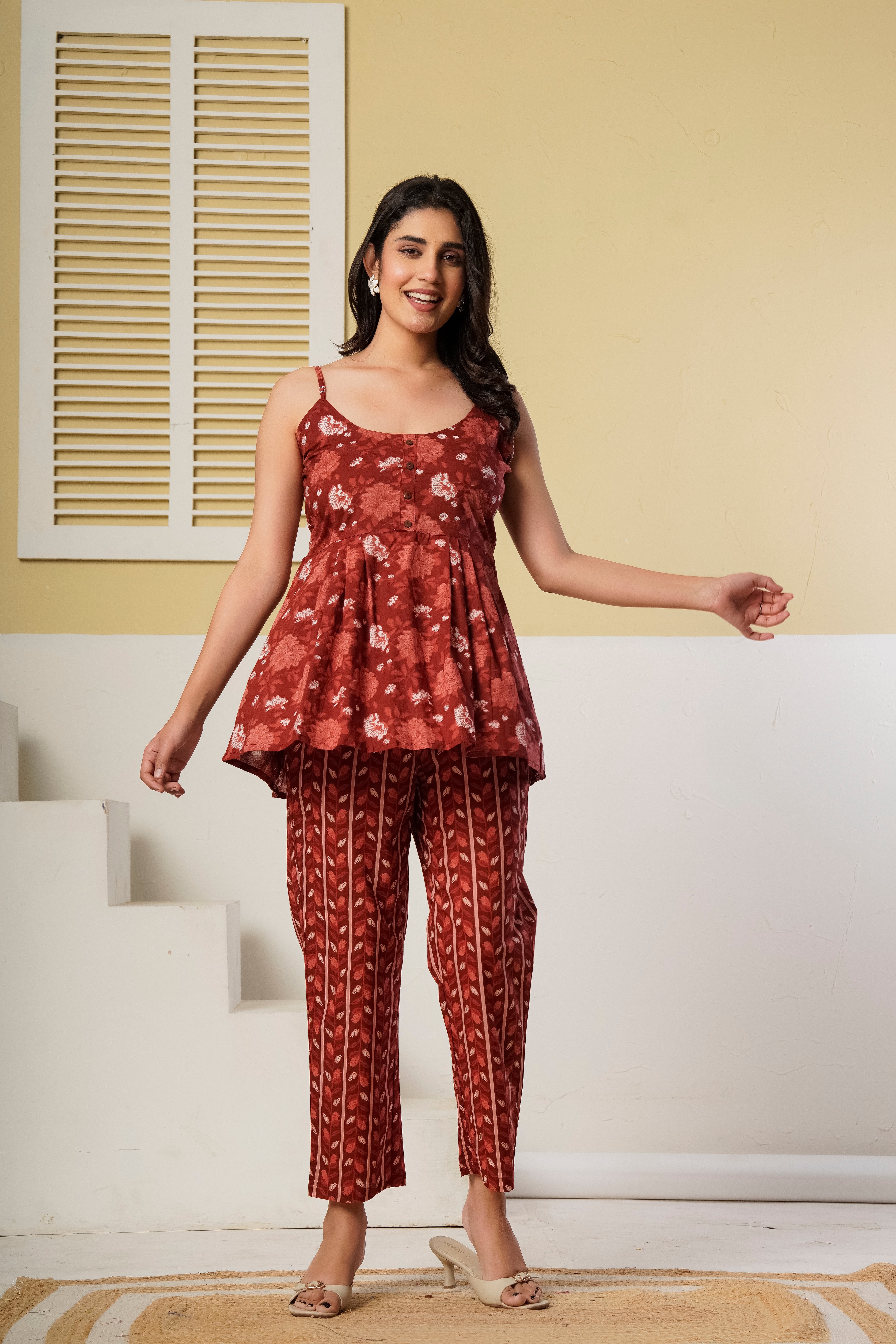 Rust red floral printed cotton co-ord set featuring a spaghetti kurti and straight pants by Rouhab