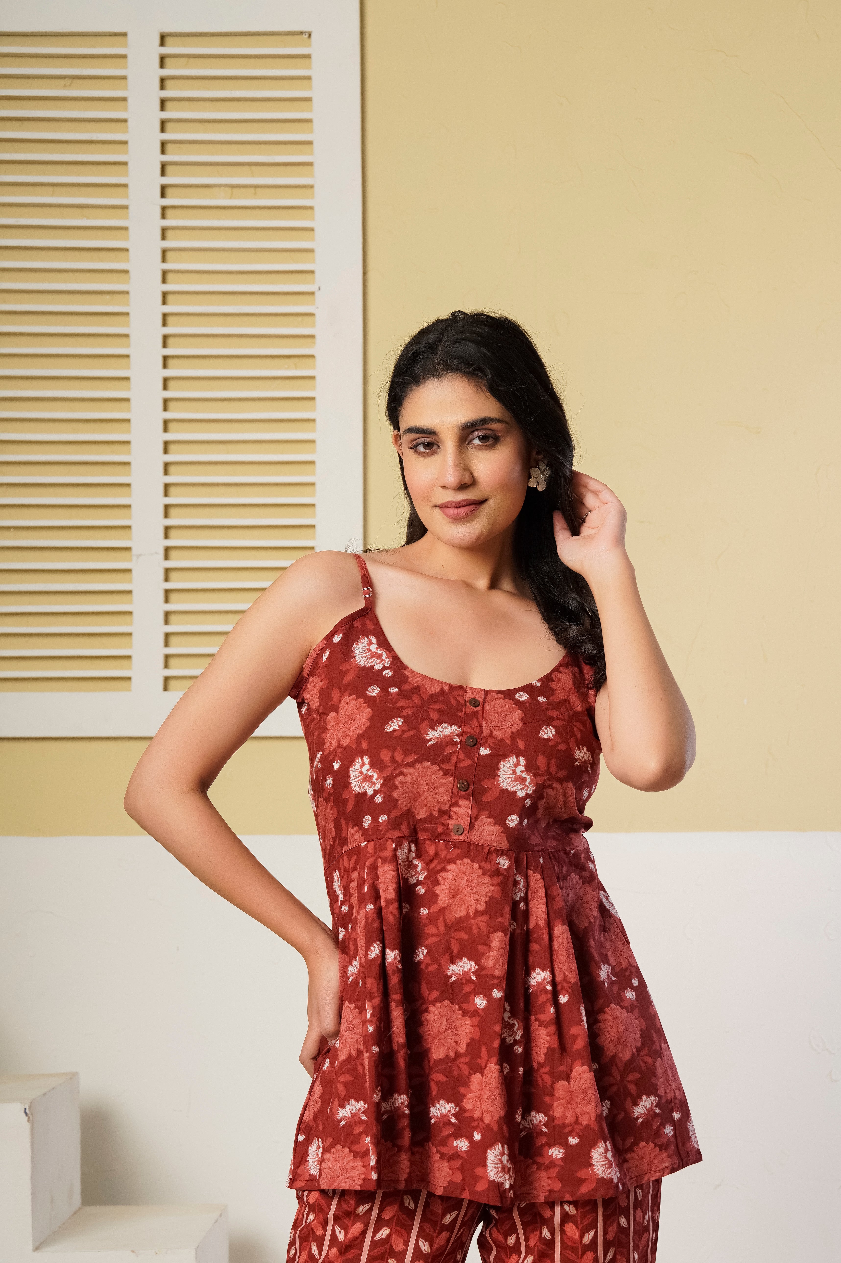 Rust red floral printed cotton co-ord set with spaghetti kurti and straight pants by Rouhab, featuring vibrant floral design.